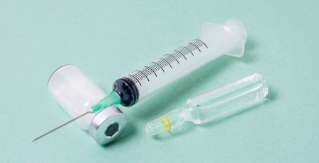 syringe and anesthesia bottle